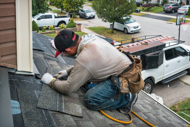 Professional Roofing technician working in New Liberty, IA